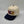 DEN 5-panel snapback seen from an angle, natural crown and navy brim, embroidered by Threaded by Sal